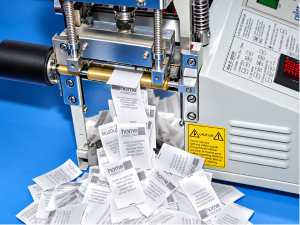 Care labels coming off the ultrasonic cutter